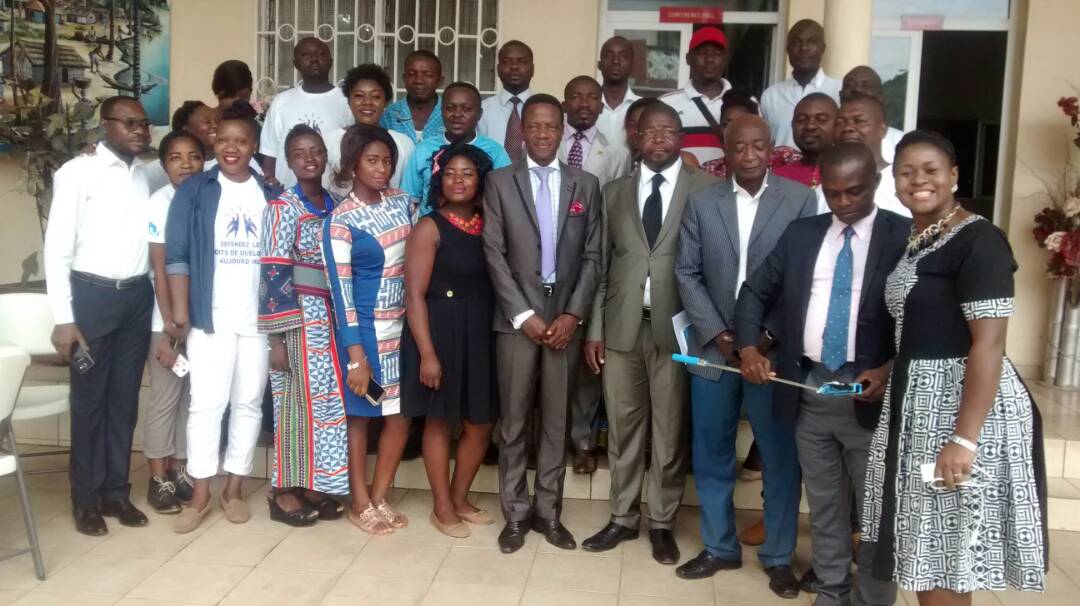 Journalists pose with UNCHRD-CA Director Ahowanou Agbessi and Elecam Board Member Tambe Tiku during training workshop in Limbe