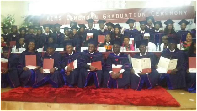 Graduates pose with dignitaries