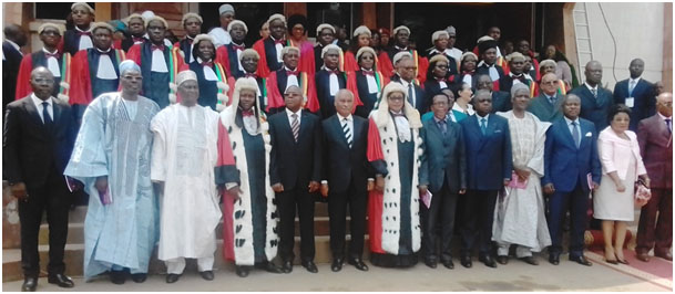 SCC President and Procureur General pose with Justice Minister Esso and other govt officials