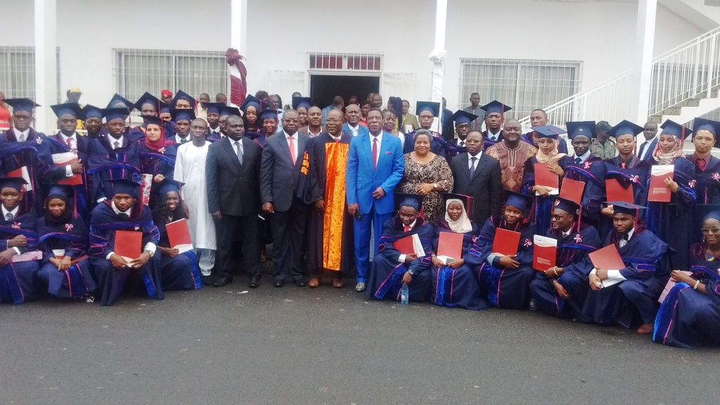 AIMS Graduates pose with officials after convocation ceremony