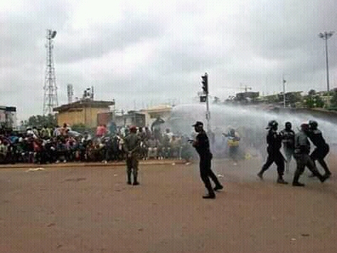 Anti-riot police teargas protesters