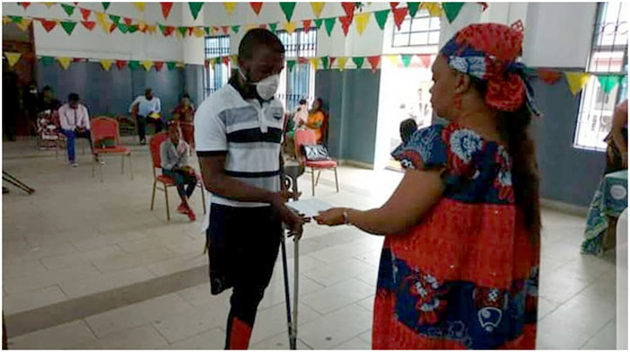 One of the physically challenged beneficiaries receiving grant from Chief of Social Centre Buea