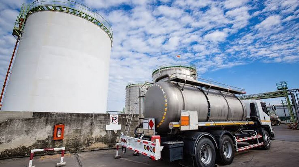 Fuel storage tank and tanker truck at a petroleum depot